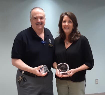 Pete Vakakes and Kim Ellis with Crye Leike awards
